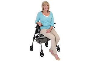 Woman sat on Able2 rollator