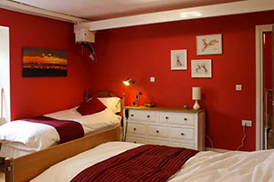 Red bedroom at the Moat House Inn